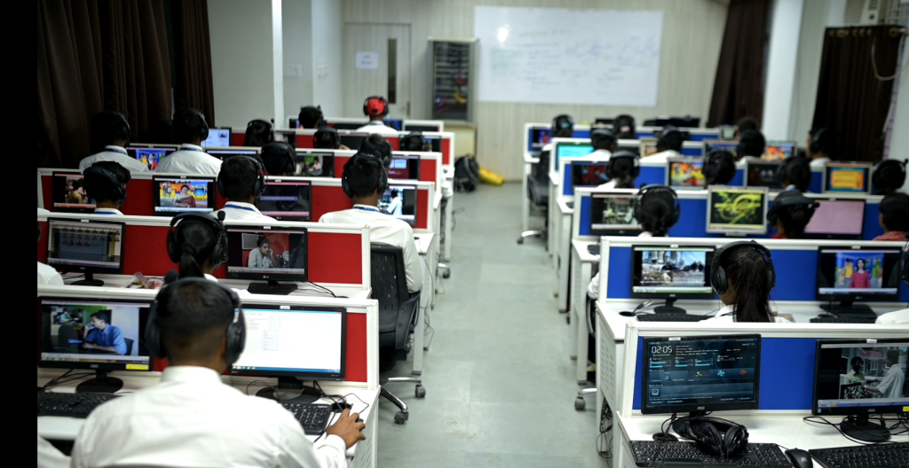 BCA students attending computer programming class in modern lab